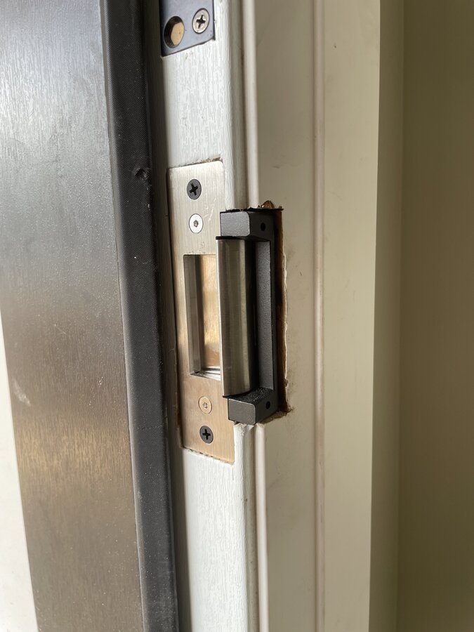 Automatic door operator installation on commercial building entrance